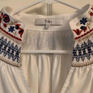 Crisp white Tibi embroidered blouse. Long sleeved with  open work panels
